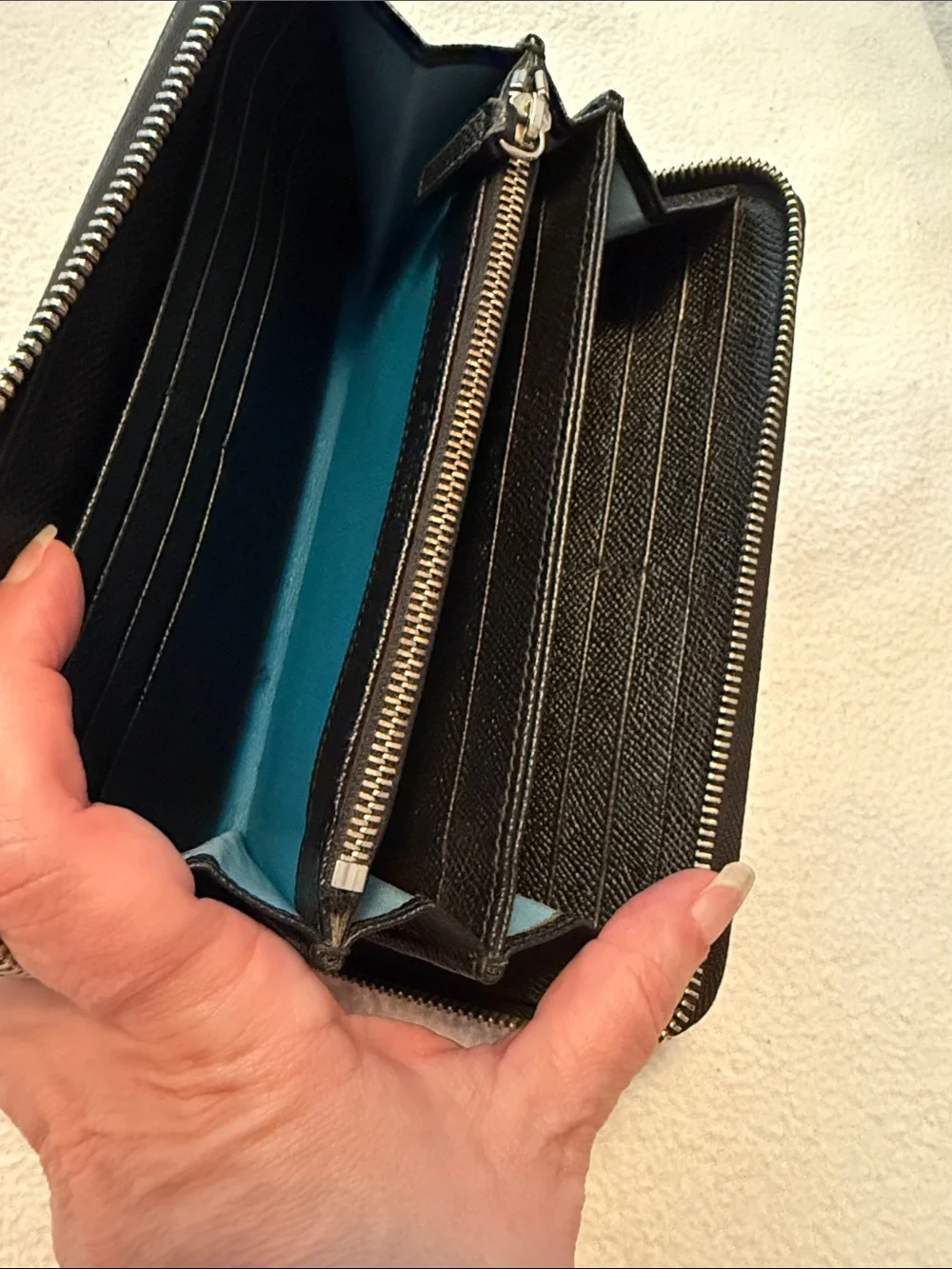 Bvlgari Zip-Around Black Leather wallet with blue interior.